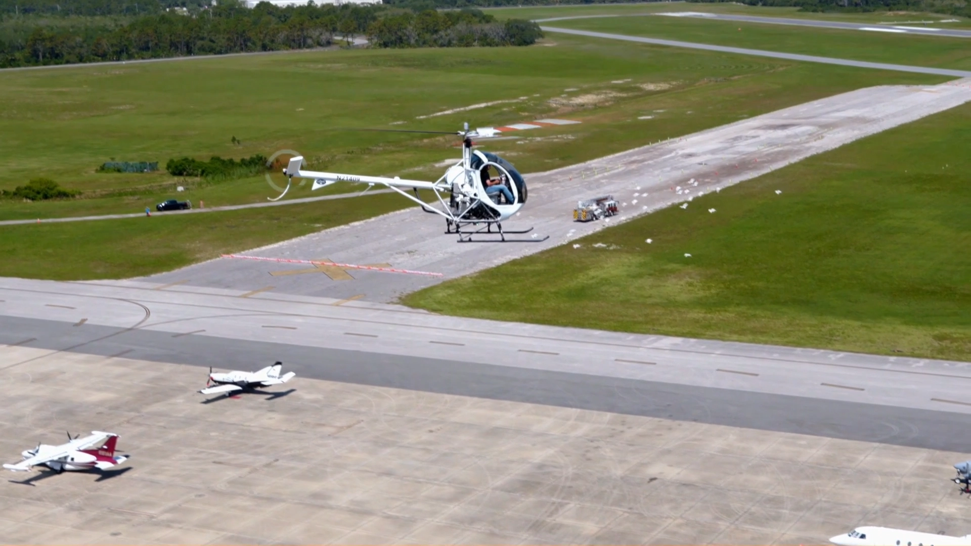USATS training helicopter hovering over the airfield at Space Coast Regional Airport